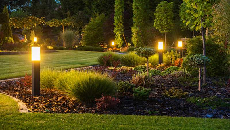 Landscape design with garden lighting and mulched beds, Midstream Estate