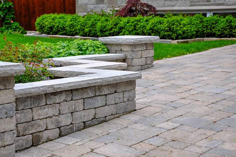 Paver patio with natural stone retaining wall and capstones, Midstream Estate