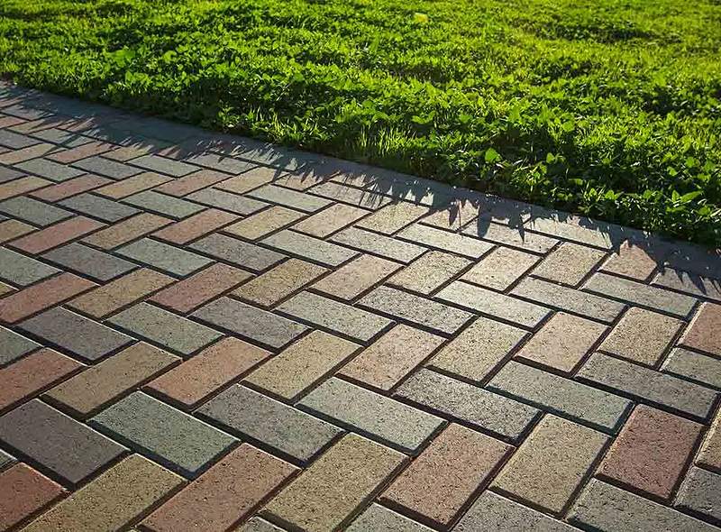 Herringbone block paving beside lawn, Centurion