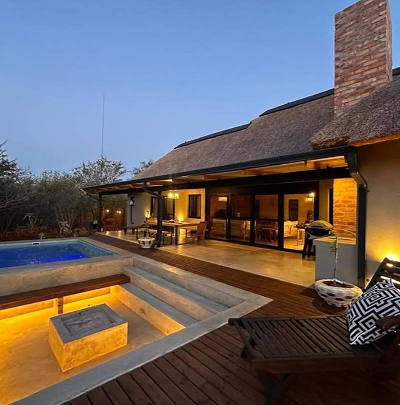 Plunge pool with sunken seating and timber deck at a thatched home, Centurion