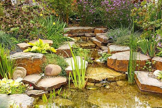 Natural stone water feature with cascading pond and planting, Midrand