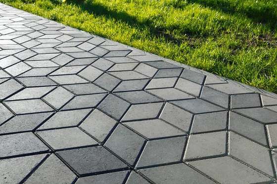 Diamond-pattern block paving beside lawn, Pretoria East