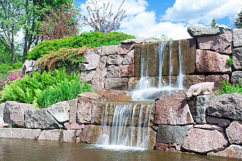 Natural stone waterfall cascading into a pond, Centurion